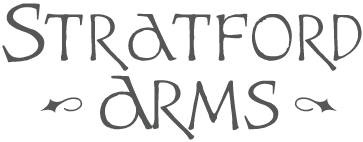 A black and white image of the words "Stratford Arms" with decorative swirls.